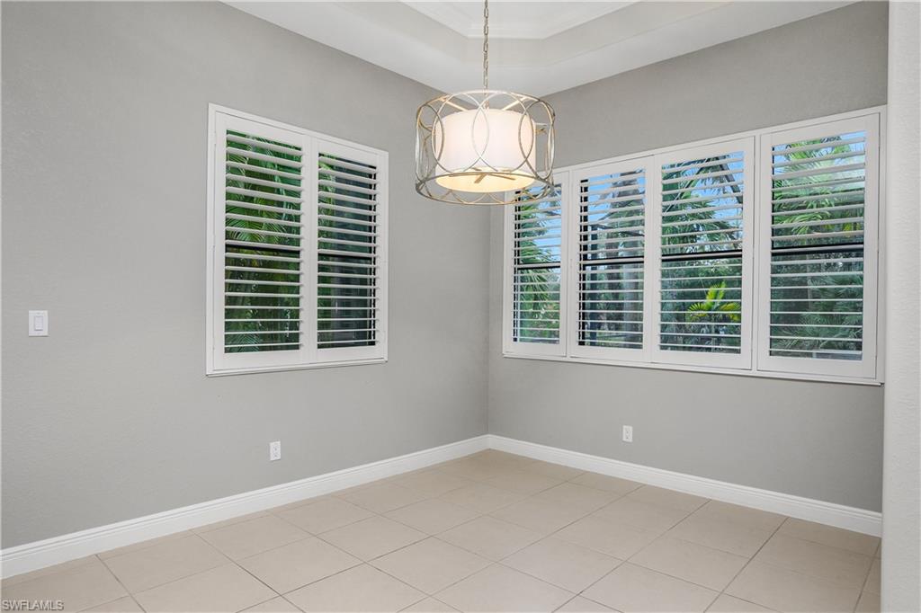 1558 Serrano Circle Naples, FL 34105 - Photo 11 of 31 a view of an empty room with a window