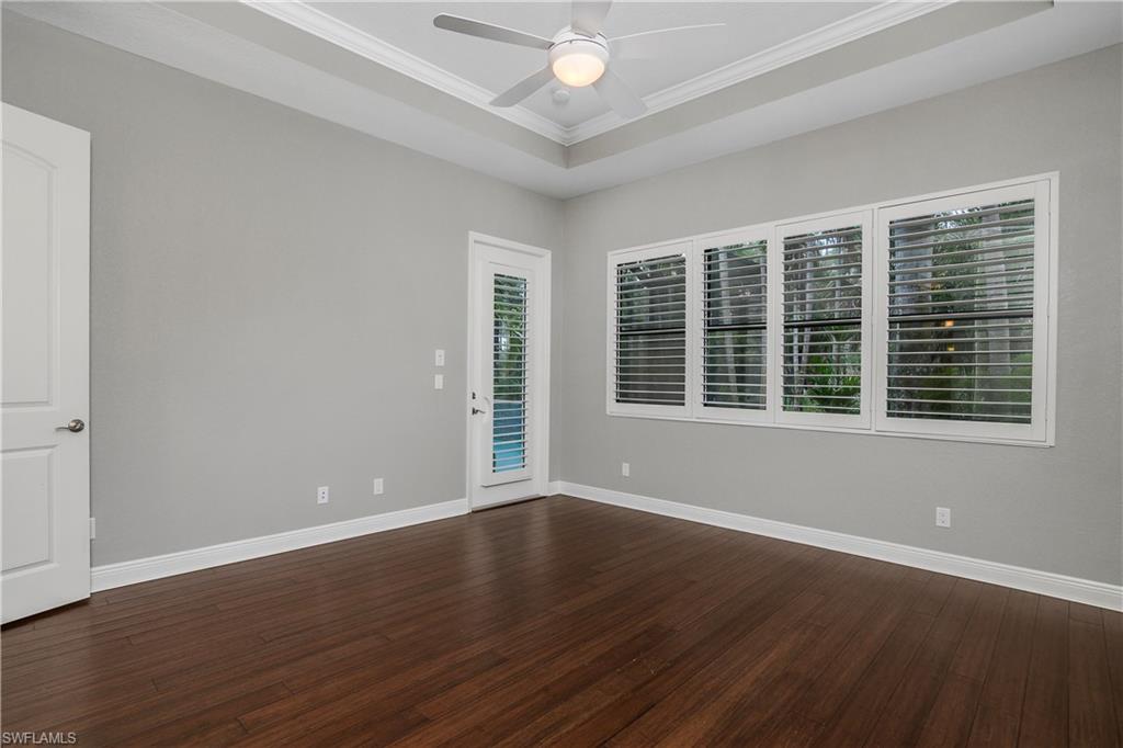 1558 Serrano Circle Naples, FL 34105 - Photo 14 of 31 a view of wooden floor and windows in a room