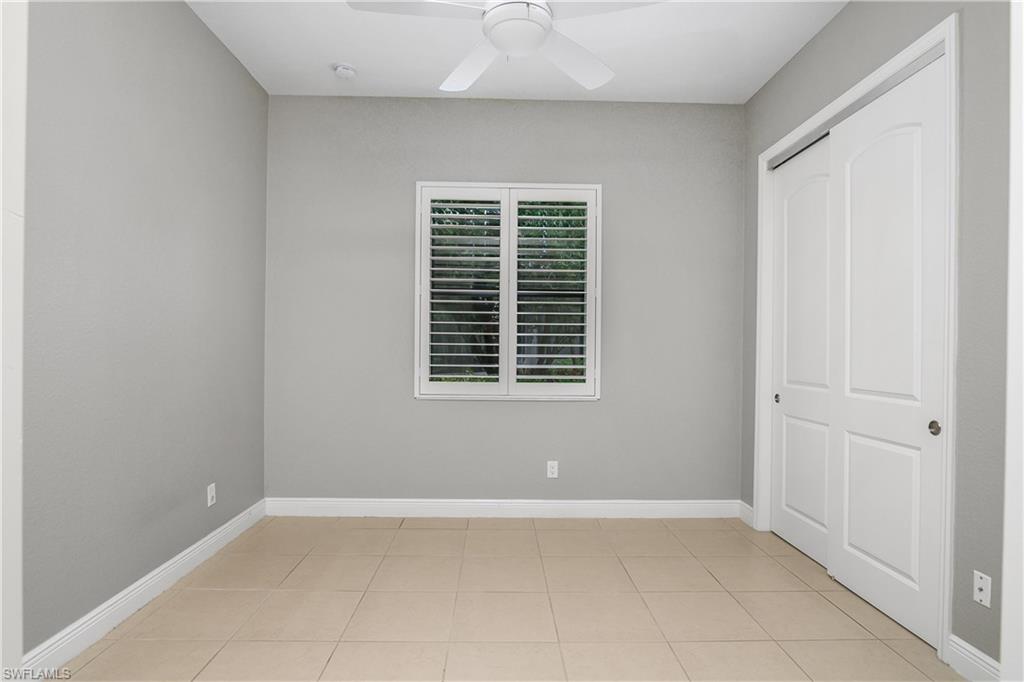 1558 Serrano Circle Naples, FL 34105 - Photo 17 of 31 an empty room with windows