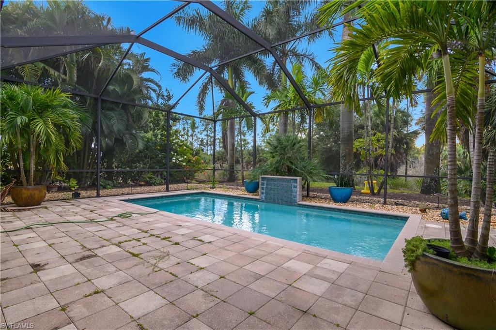 1558 Serrano Circle Naples, FL 34105 - Photo 23 of 31 a view of a backyard with swimming pool