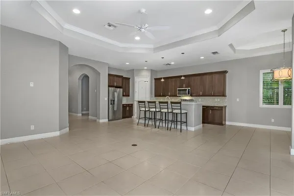a view of a kitchen with a sink and microwave