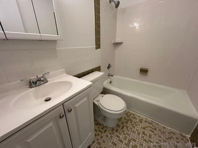 5 West Washington Avenue, Unit 7 Stamford, CT 06902 - Photo 7 of 9 a bathroom with a sink toilet and shower