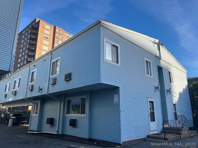 5 West Washington Avenue, Unit 7 Stamford, CT 06902 - Photo 9 of 9 a front view of a house with balcony