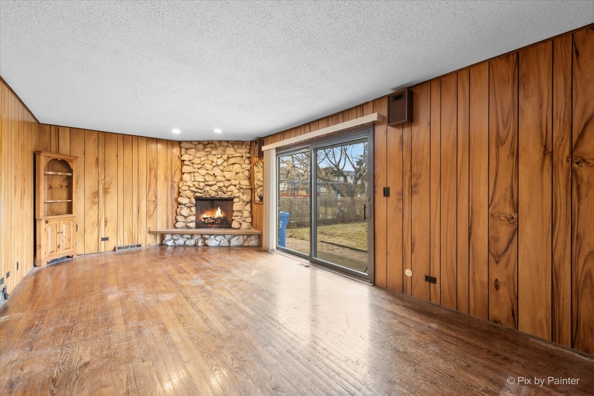 1100 South Church Road Mount Prospect, IL 60056 - Photo 12 of 50 a view of an empty room with wooden floor and a window