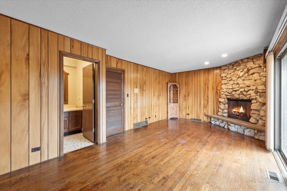 1100 South Church Road Mount Prospect, IL 60056 - Photo 13 of 50 a view of an empty room with a fireplace and a window