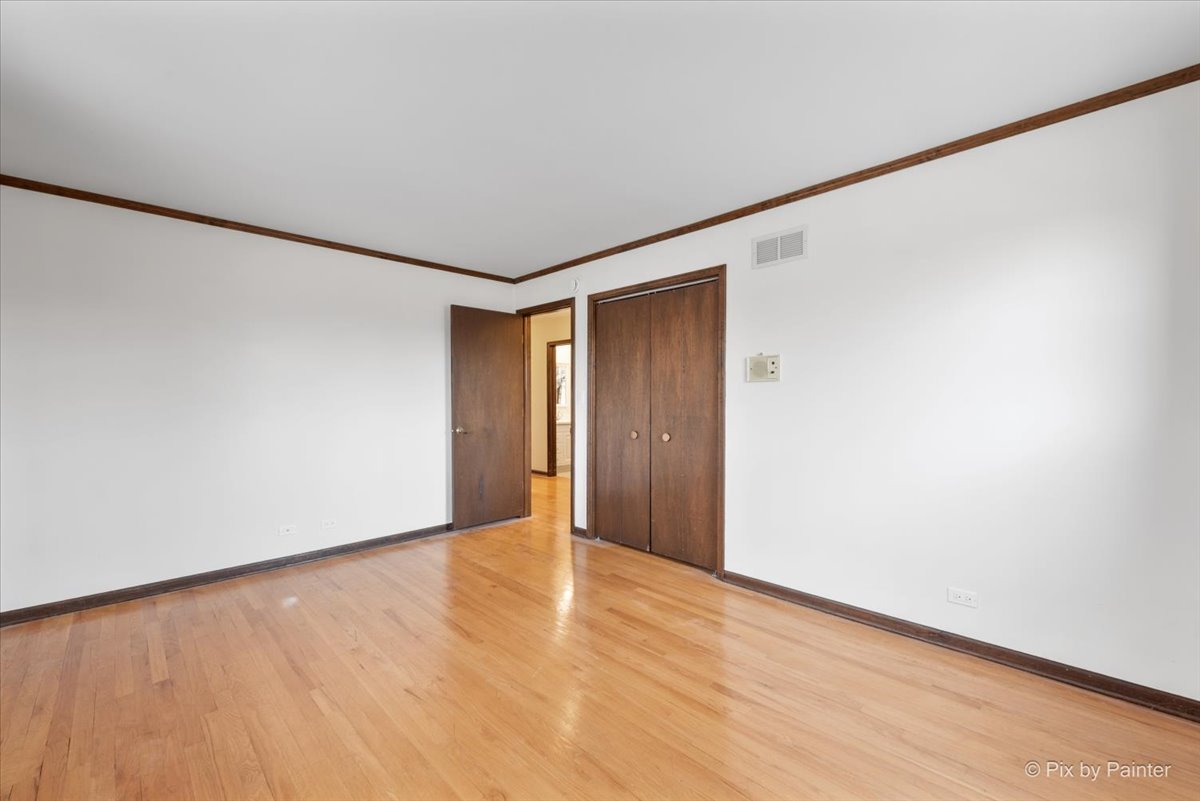 1100 South Church Road Mount Prospect, IL 60056 - Photo 24 of 50 a view of an empty room with wooden floor
