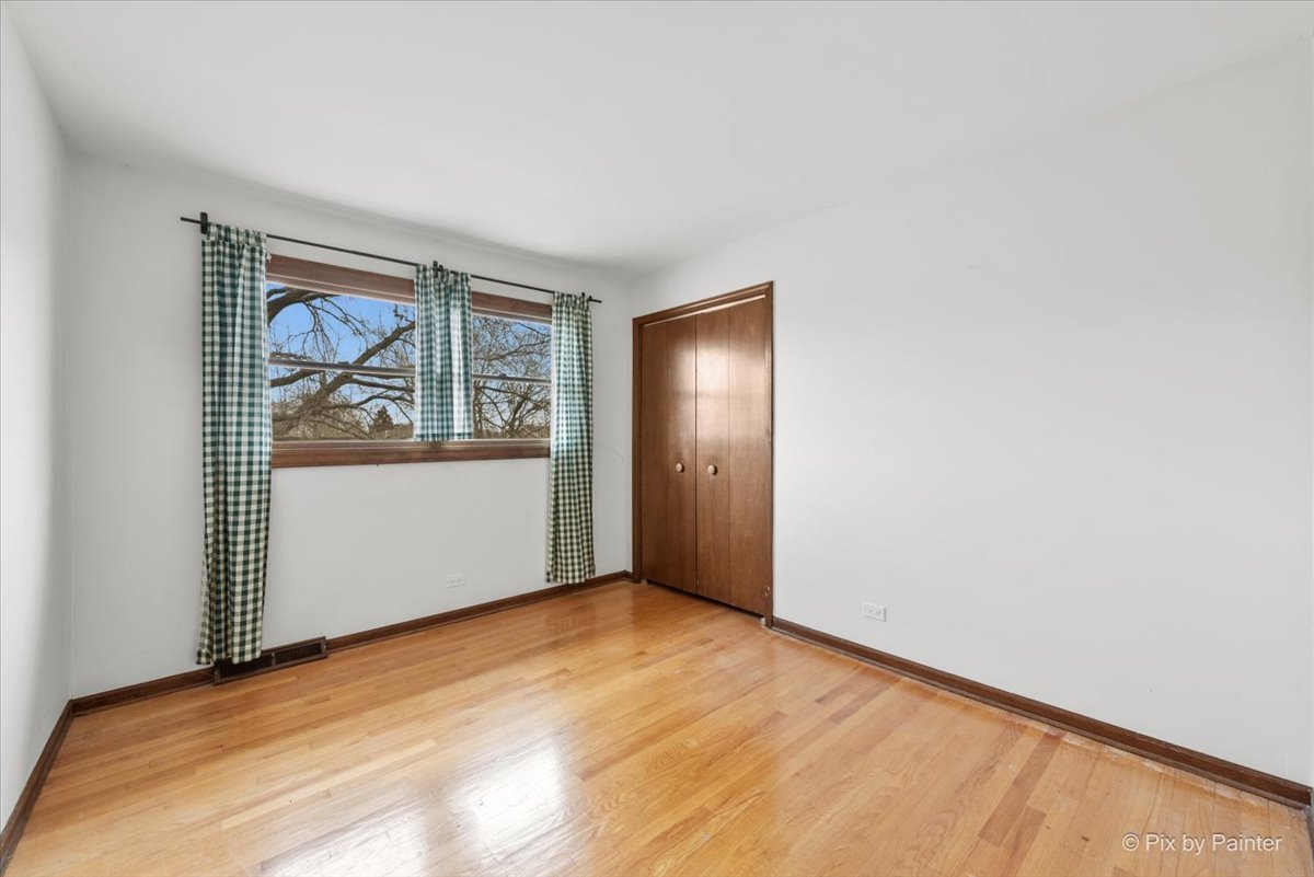 1100 South Church Road Mount Prospect, IL 60056 - Photo 25 of 50 an empty room with windows and closet