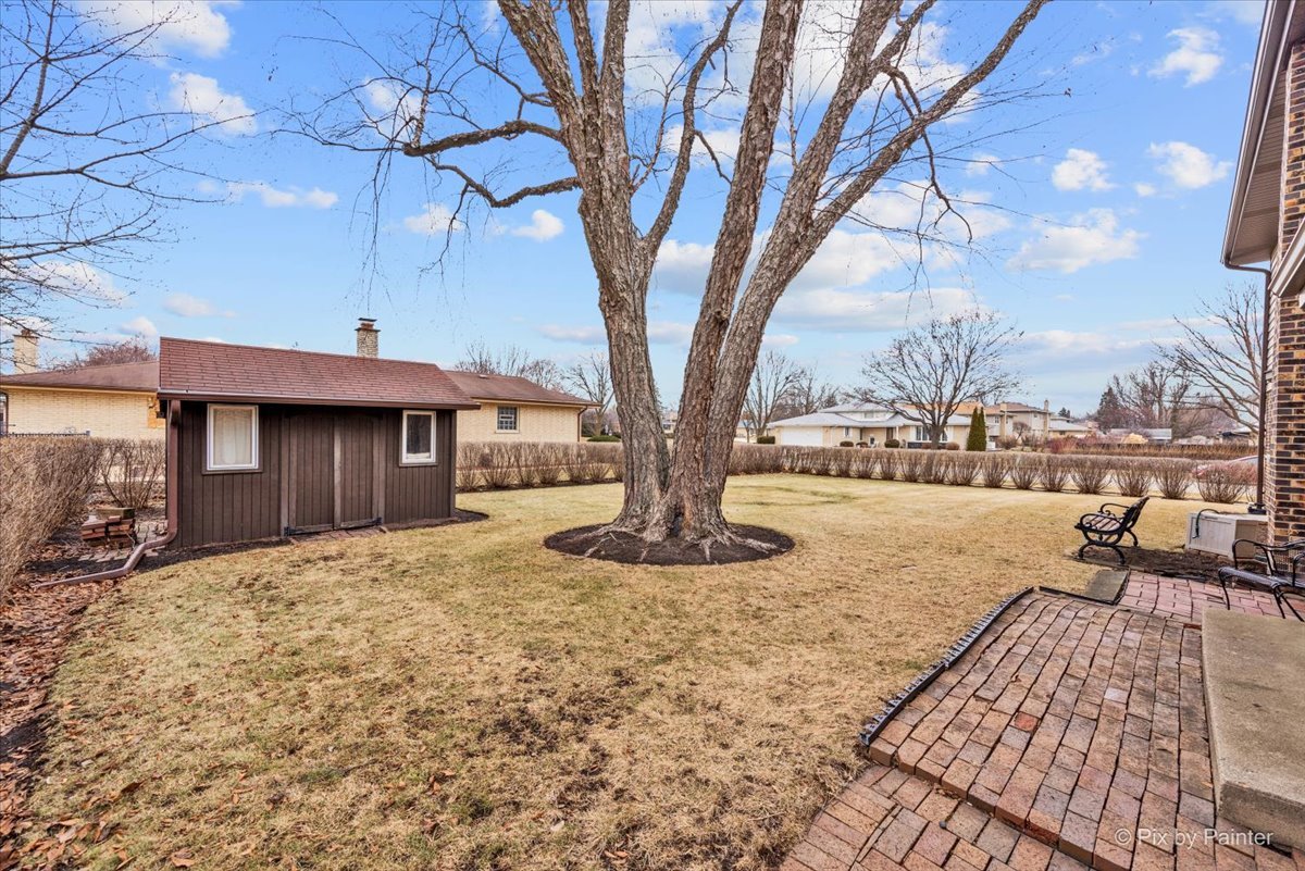1100 South Church Road Mount Prospect, IL 60056 - Photo 41 of 50 a view of a house with backyard and trees