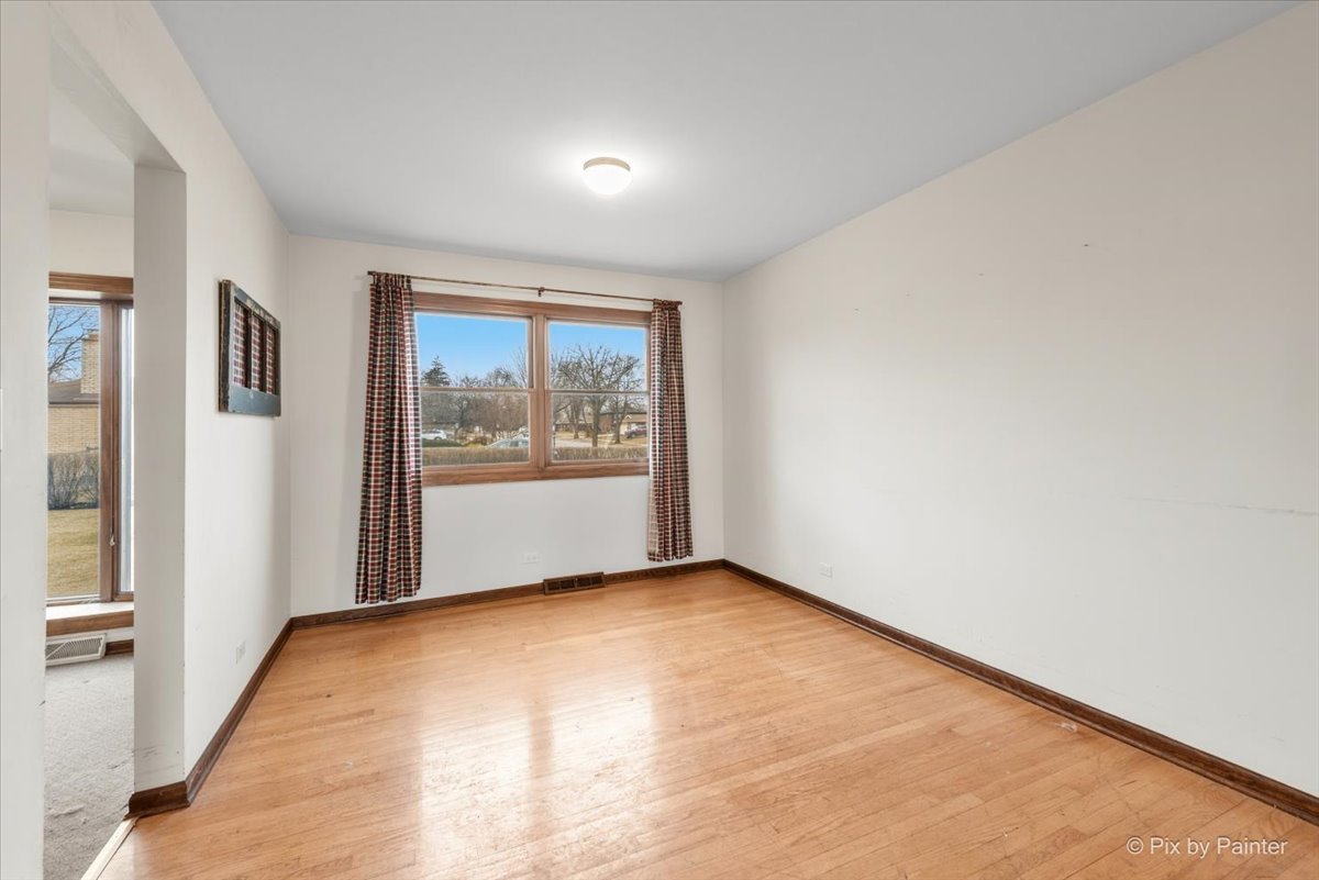 1100 South Church Road Mount Prospect, IL 60056 - Photo 6 of 50 a view of an empty room with a window