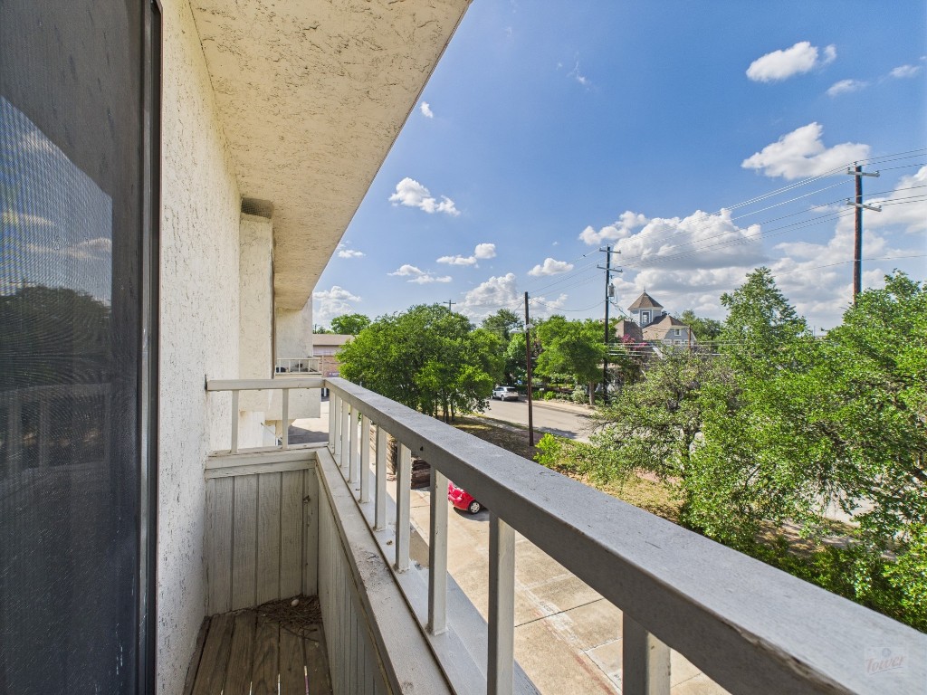 3115 Helms Street, Unit 202 Austin, TX 78705 - Photo 14 of 26 a view of a balcony with a street