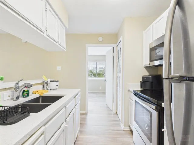 a kitchen with a microwave and a stove