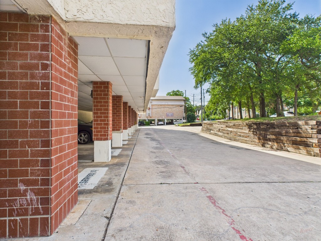 3115 Helms Street, Unit 202 Austin, TX 78705 - Photo 24 of 26 a view of a pathway with a building in the background