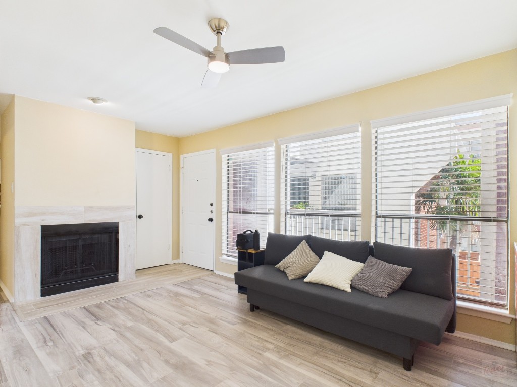3115 Helms Street, Unit 202 Austin, TX 78705 - Photo 3 of 26 a living room with furniture and a large window