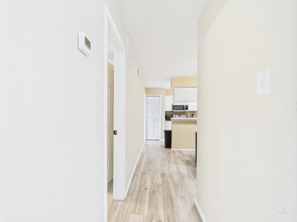 3115 Helms Street, Unit 202 Austin, TX 78705 - Photo 8 of 26 a view of a kitchen from the hallway