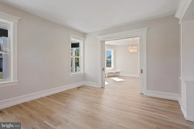 a kitchen with stainless steel appliances a stove a microwave and a hard wood floors