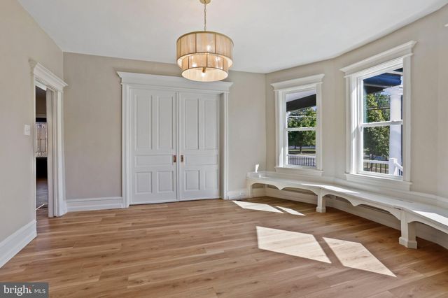 a bedroom with a bed and a television