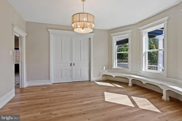 a bedroom with a bed and a television
