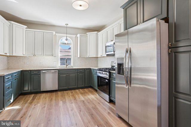 a bathroom with a bathtub and a sink