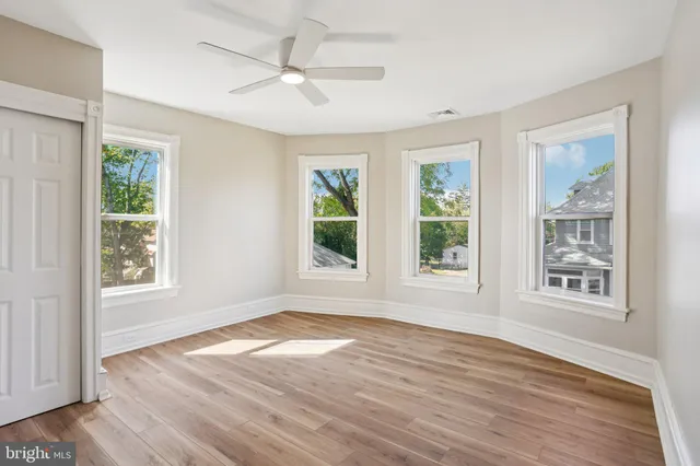 a view of empty room with wooden ceiling