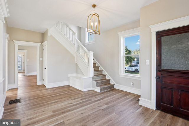 a view of livingroom with hardwood floor and hallway