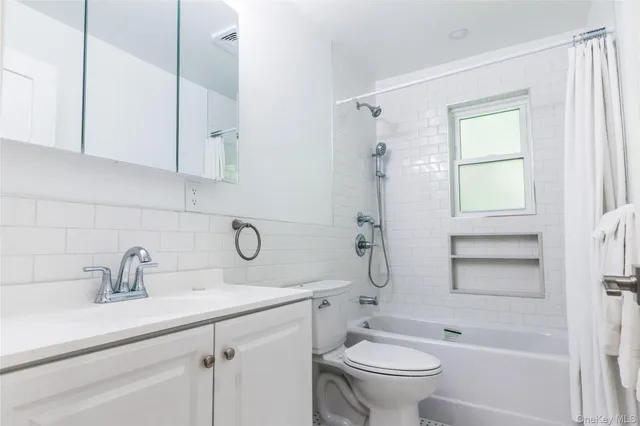 a bedroom with bed and window