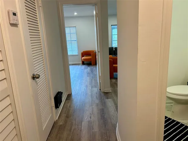 a bedroom with a bed and a chair