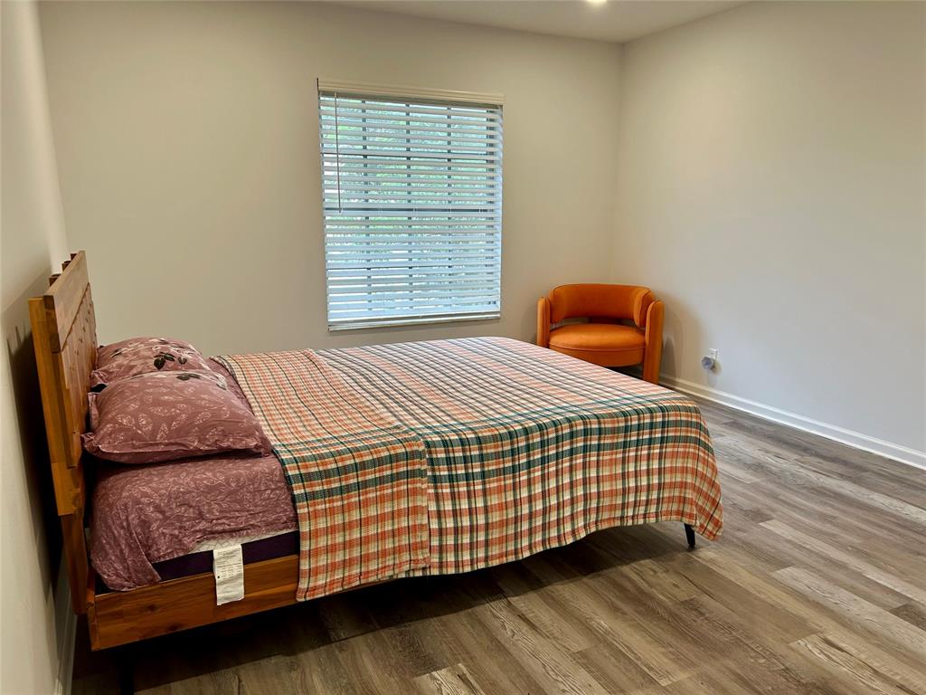 2151 Northeast 68th Street, Unit 226 Fort Lauderdale, FL 33308 - Photo 12 of 49 a bedroom with a bed and window