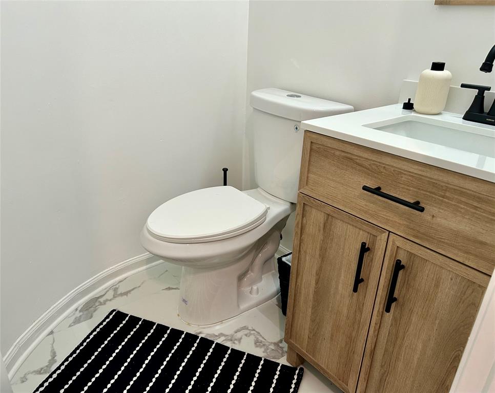 2151 Northeast 68th Street, Unit 226 Fort Lauderdale, FL 33308 - Photo 23 of 49 a bathroom with a sink and a toilet