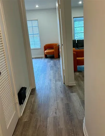 a view of a swimming pool with outdoor seating