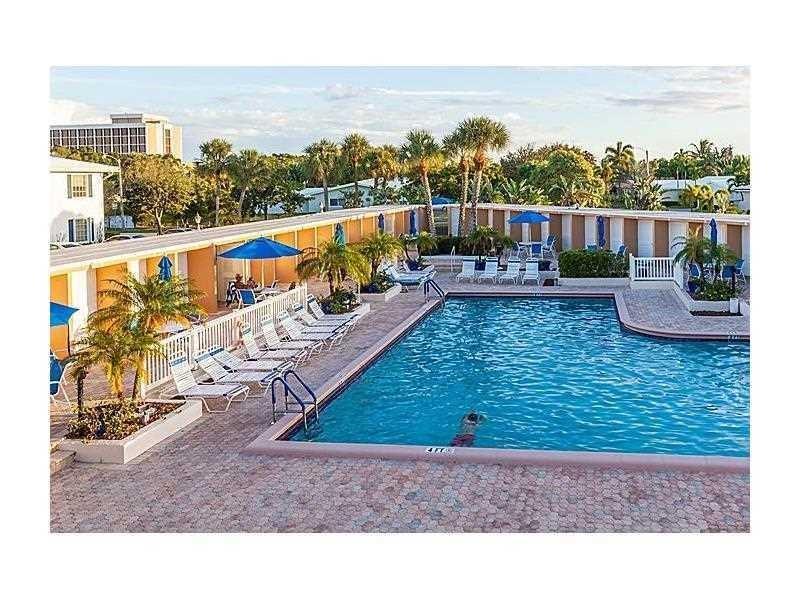 2151 Northeast 68th Street, Unit 226 Fort Lauderdale, FL 33308 - Photo 29 of 49 a view of a swimming pool with a terrace