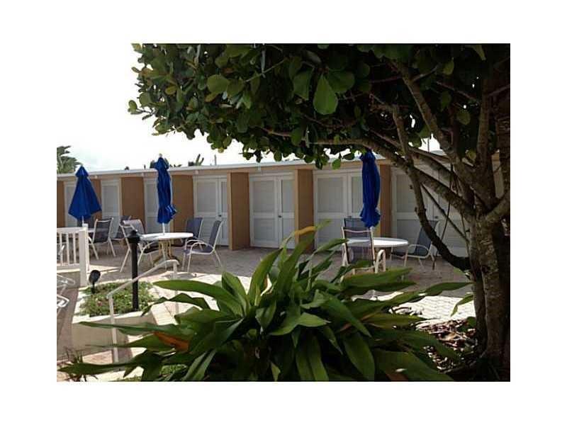 2151 Northeast 68th Street, Unit 226 Fort Lauderdale, FL 33308 - Photo 32 of 49 a view of a chairs and table in a patio