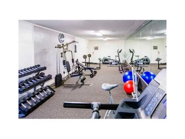 a view of a backyard with sitting area