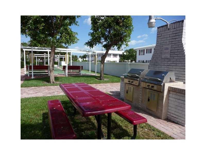 2151 Northeast 68th Street, Unit 226 Fort Lauderdale, FL 33308 - Photo 34 of 49 a view of a backyard with sitting area