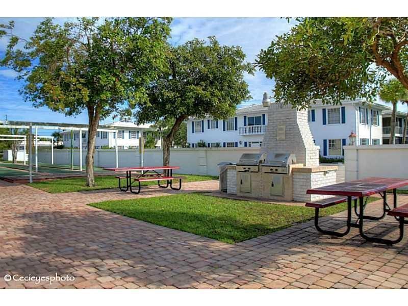 2151 Northeast 68th Street, Unit 226 Fort Lauderdale, FL 33308 - Photo 35 of 49 a house view with a sitting space and garden