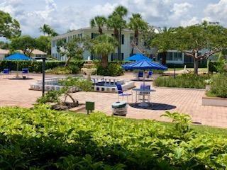 2151 Northeast 68th Street, Unit 226 Fort Lauderdale, FL 33308 - Photo 41 of 49 a view of a patio with chairs and plants