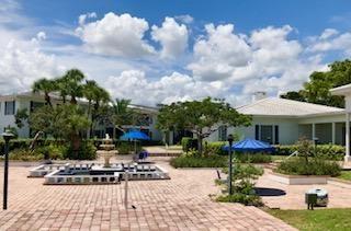 2151 Northeast 68th Street, Unit 226 Fort Lauderdale, FL 33308 - Photo 42 of 49 a view of a house with sitting area and fire pit
