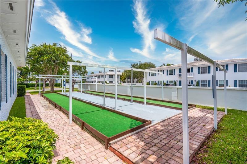 2151 Northeast 68th Street, Unit 226 Fort Lauderdale, FL 33308 - Photo 46 of 49 a view of a house with a swimming pool