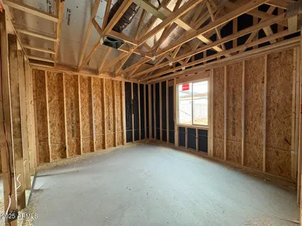 a view of an empty room with windows