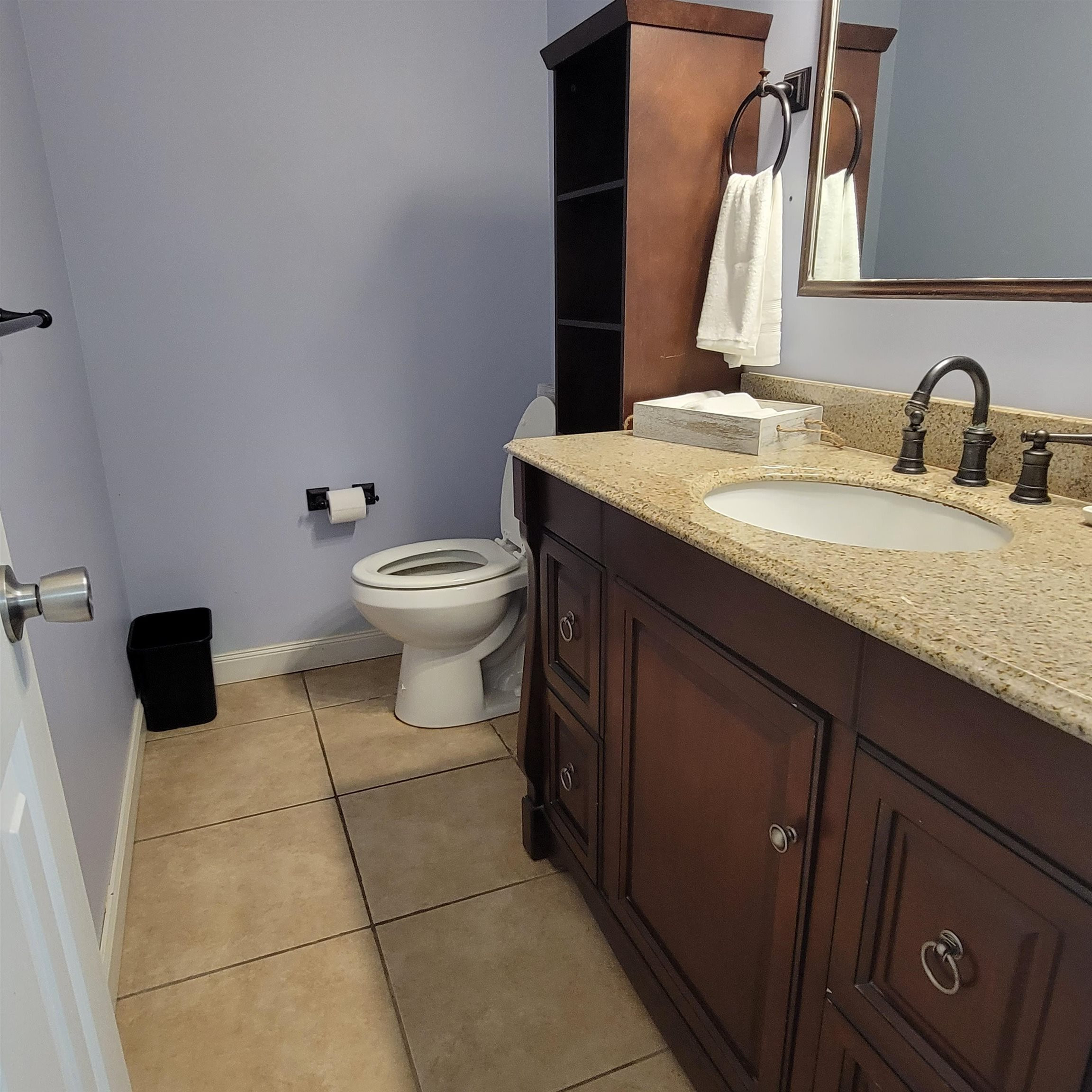 3106 Riverside Drive Jackson, TN 38301 - Photo 13 of 19 a bathroom with a granite countertop toilet sink and mirror
