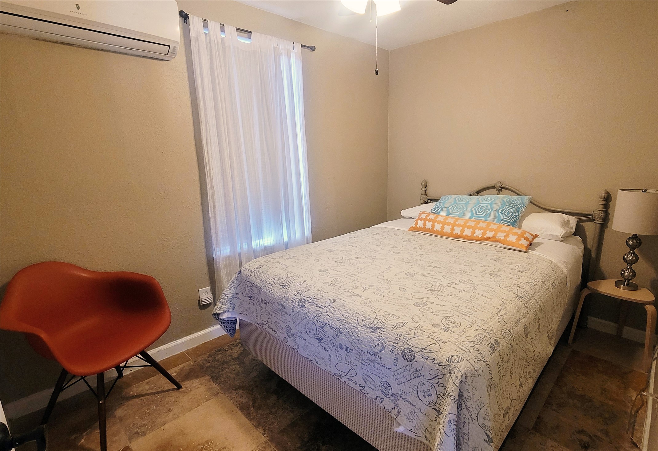 12410 Twin Creek Road Manchaca, TX 78652 - Photo 32 of 32 Bedroom with an AC wall unit and a ceiling fan