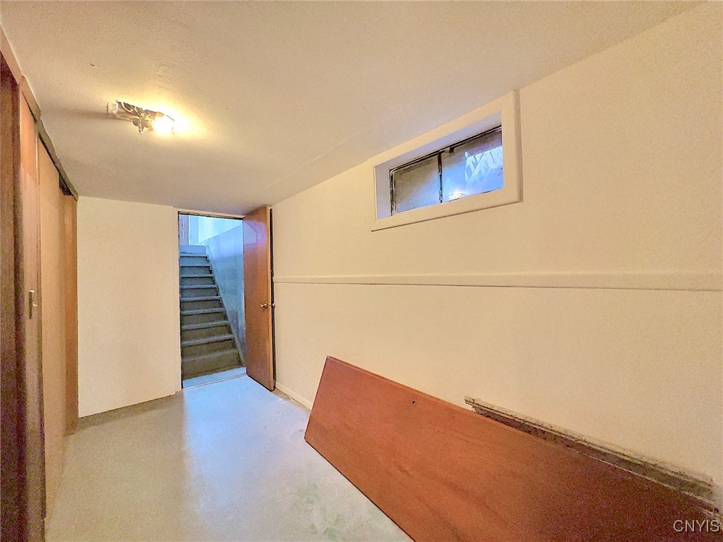 135 Glen Road Rome, NY 13440 - Photo 19 of 34 Basement hallway (stairs to garage)