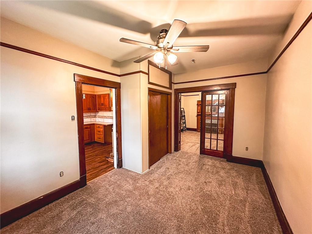 276 13th Street, Unit 1 Ambridge, PA 15003 - Photo 11 of 17 an empty room with fan and windows