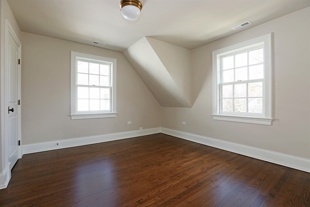 116 South Adams Street Hinsdale, IL 60521 - Photo 17 of 25 an empty room with wooden floor and windows