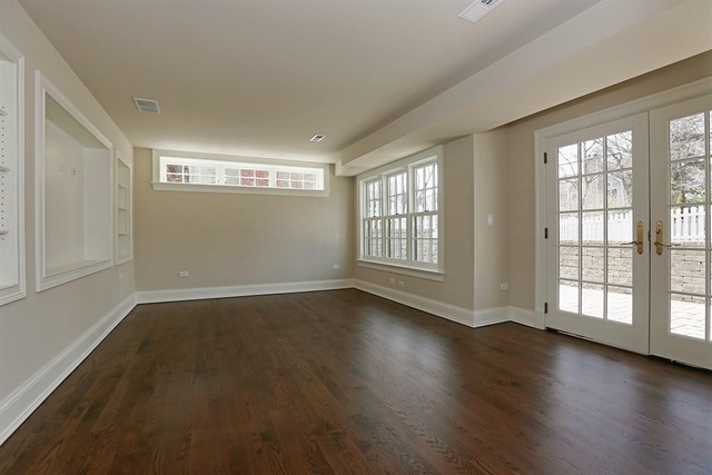 116 South Adams Street Hinsdale, IL 60521 - Photo 22 of 25 an empty room with wooden floor and windows