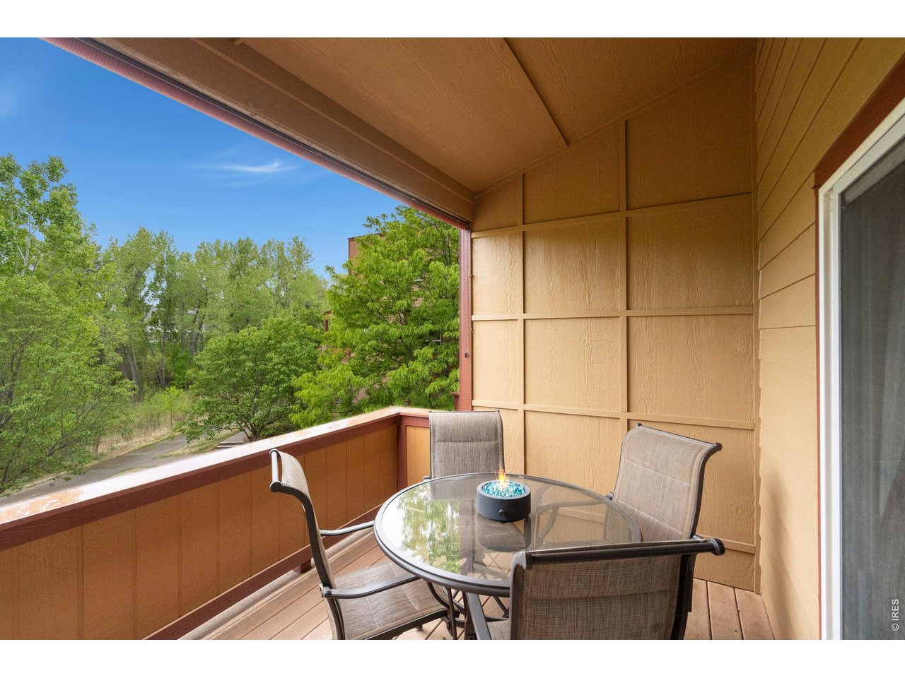 1221 East Prospect Road, Unit 3 Fort Collins, CO 80525 - Photo 15 of 37 Main level covered deck provides the opportunity to catch some sun and enjoy views and nature.