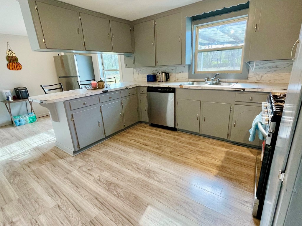 2504 Davisville Road Lufkin, TX 75901 - Photo 11 of 26 a kitchen with a sink appliances cabinets and a window