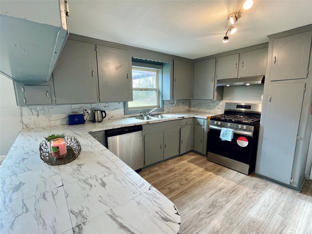2504 Davisville Road Lufkin, TX 75901 - Photo 12 of 26 a kitchen with a sink cabinets and appliances