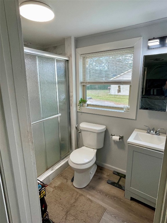 2504 Davisville Road Lufkin, TX 75901 - Photo 14 of 26 a bathroom with a toilet sink a window and a shower