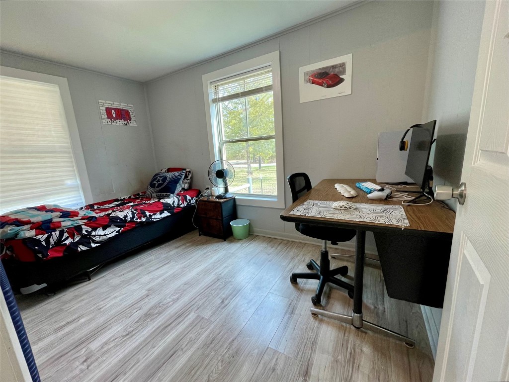 2504 Davisville Road Lufkin, TX 75901 - Photo 15 of 26 a bedroom with a bed and a window