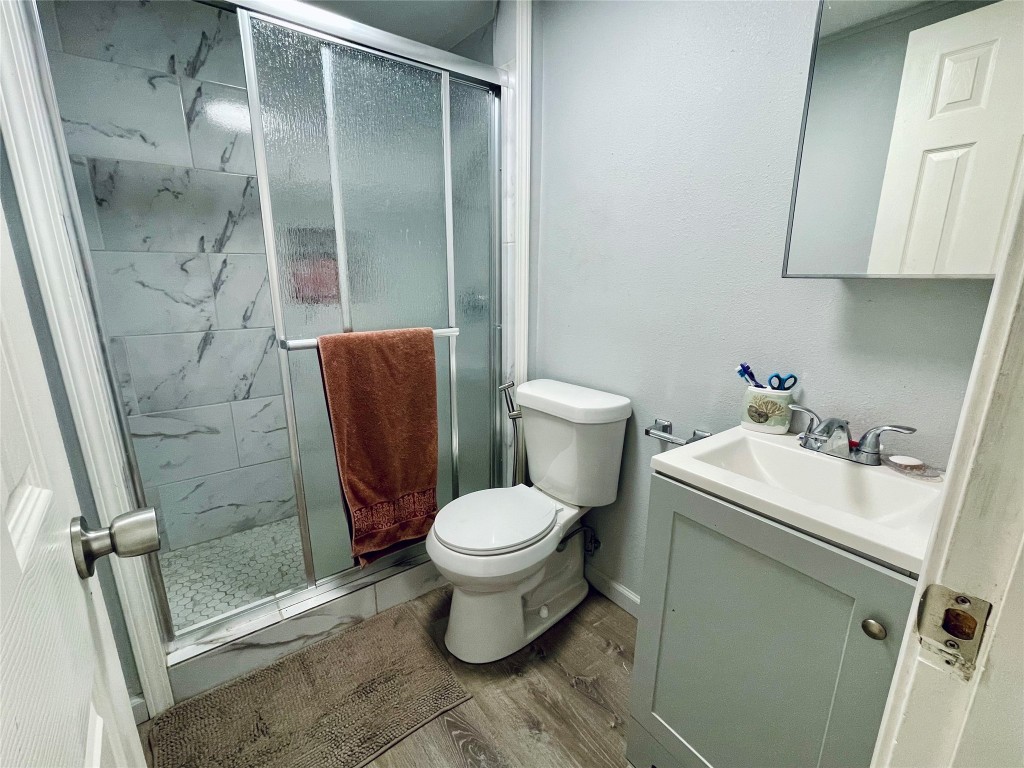 2504 Davisville Road Lufkin, TX 75901 - Photo 16 of 26 a bathroom with a toilet and a shower